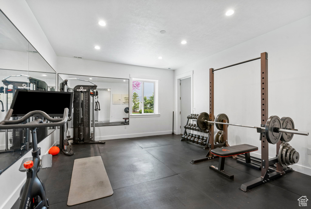 Workout area featuring recessed lighting and baseboards