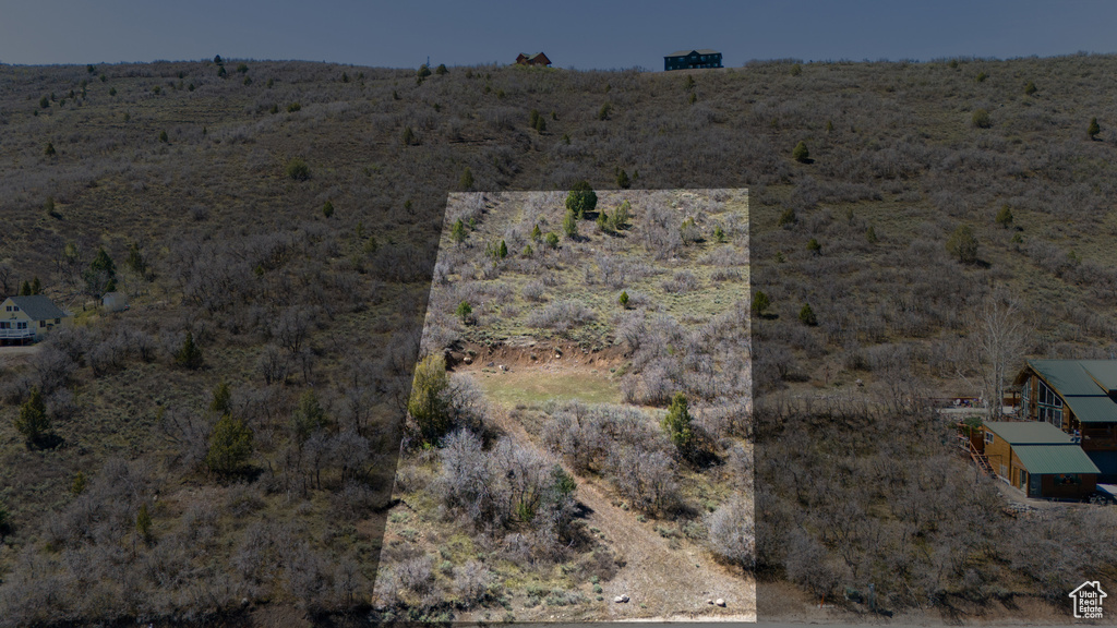Birds eye view of property featuring a rural view