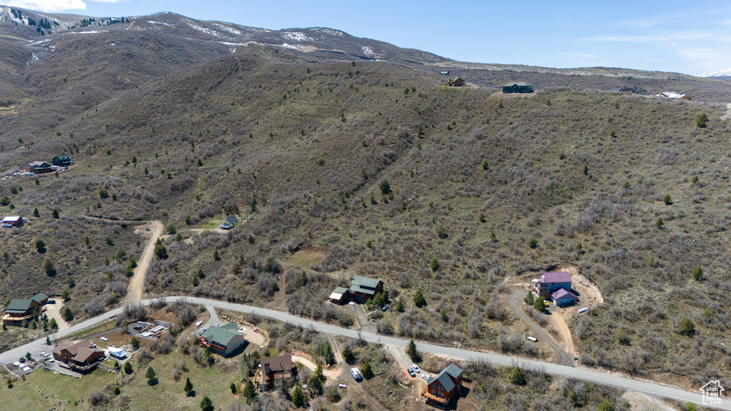 Birds eye view of property featuring a mountain view and a rural view