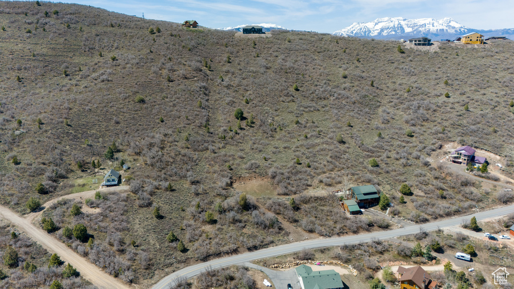 Drone / aerial view with a mountain view, a rural view, and view of desert