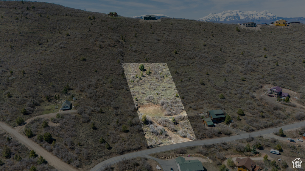 Birds eye view of property featuring a rural view and a desert view