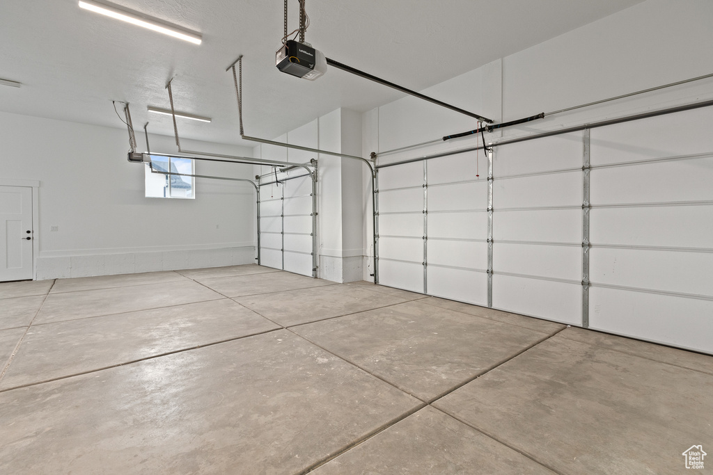 Garage featuring a garage door opener