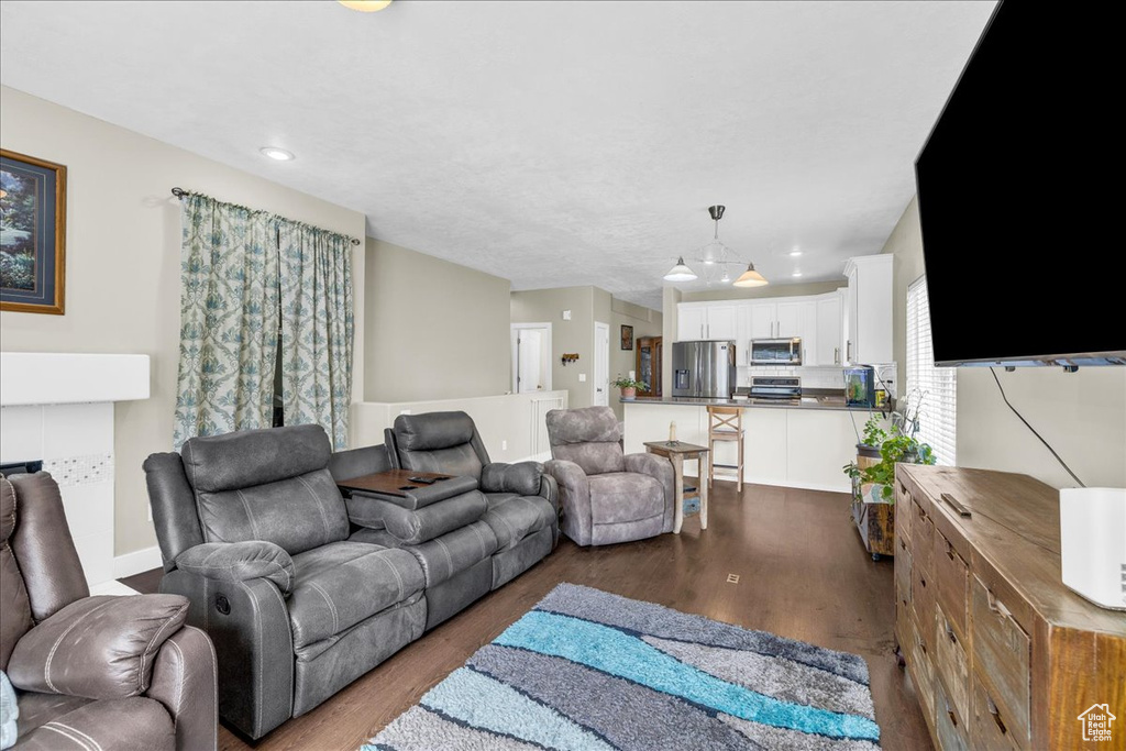 Living room with recessed lighting and wood finished floors