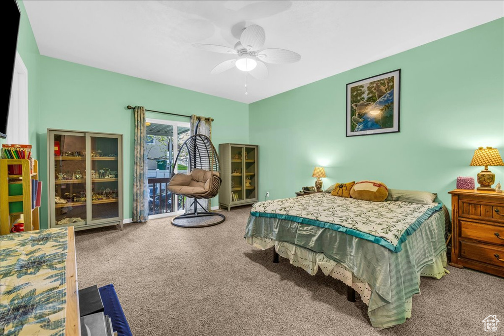 Bedroom featuring ceiling fan and carpet floors