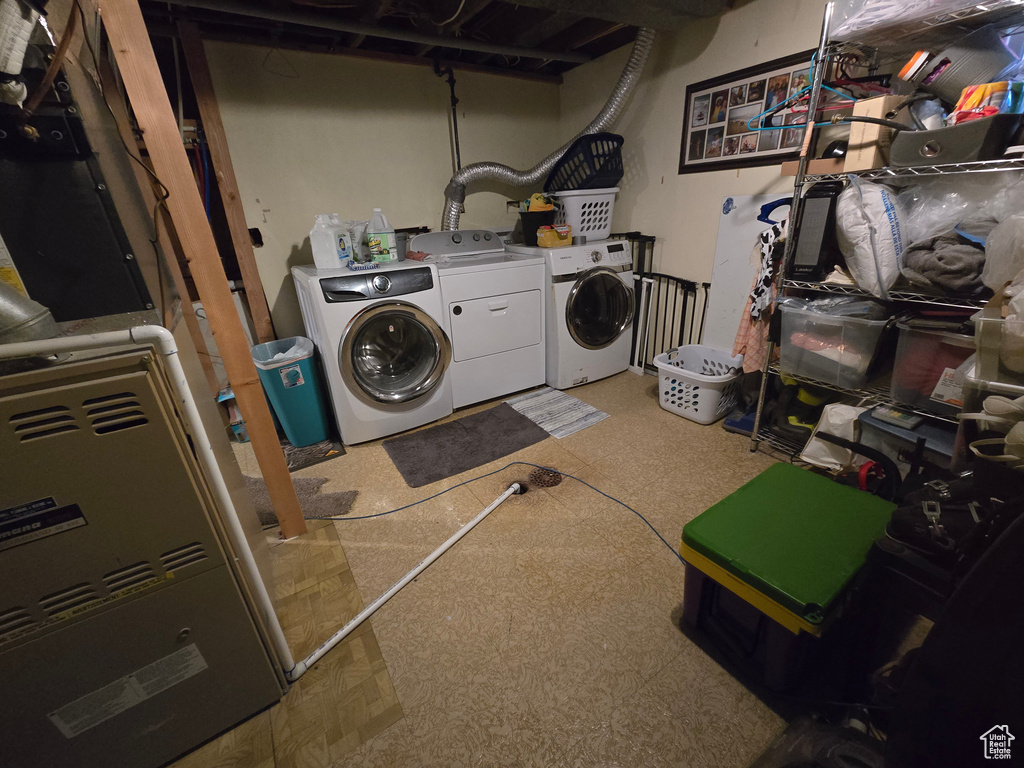 Laundry area featuring washing machine and dryer and laundry area