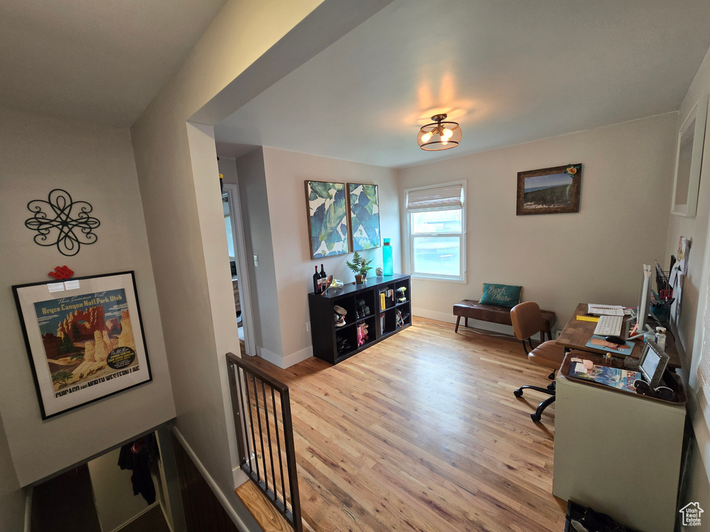 Office area featuring baseboards and wood finished floors
