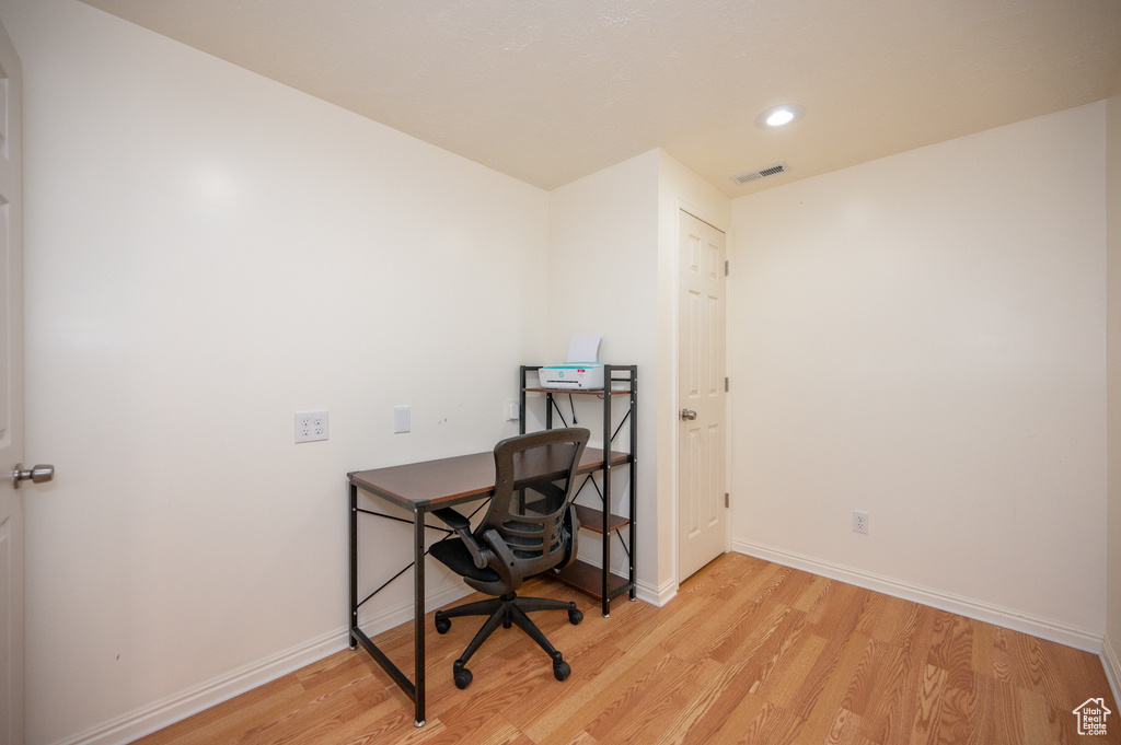 Office with visible vents, recessed lighting, light wood-style flooring, and baseboards