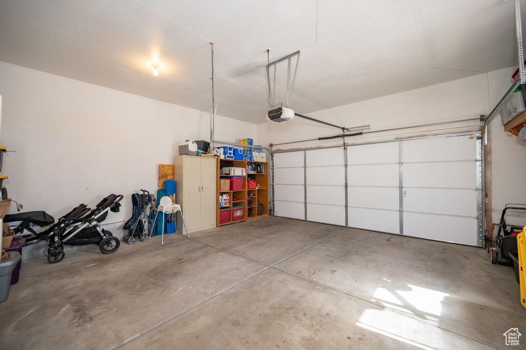 Garage featuring a garage door opener