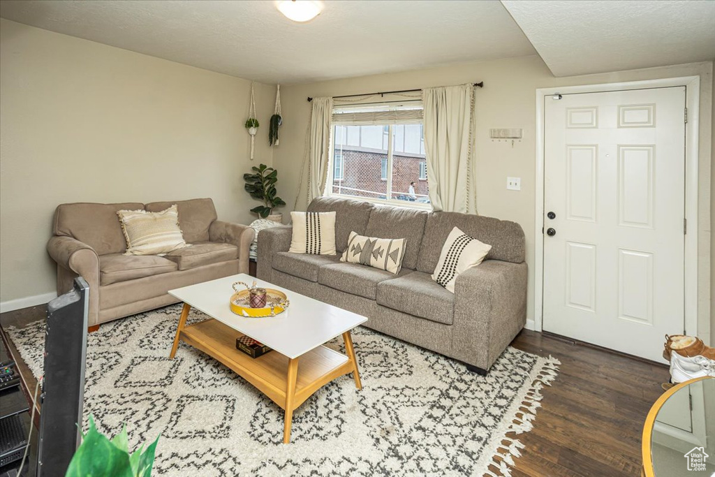 Living area featuring wood finished floors and baseboards