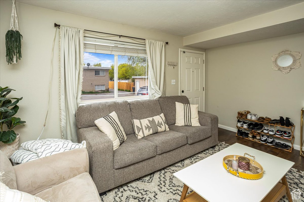 Living room featuring wood finished floors and baseboards