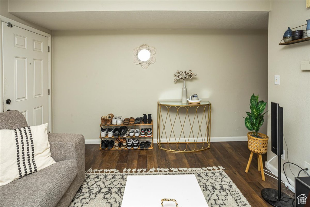 Living area featuring wood finished floors and baseboards