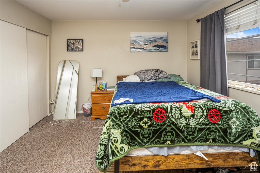 Bedroom with carpet floors and a closet