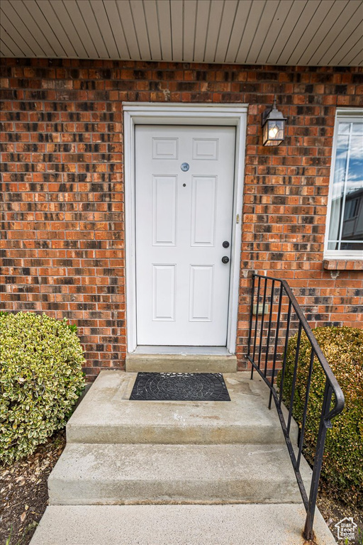 Property entrance with brick siding