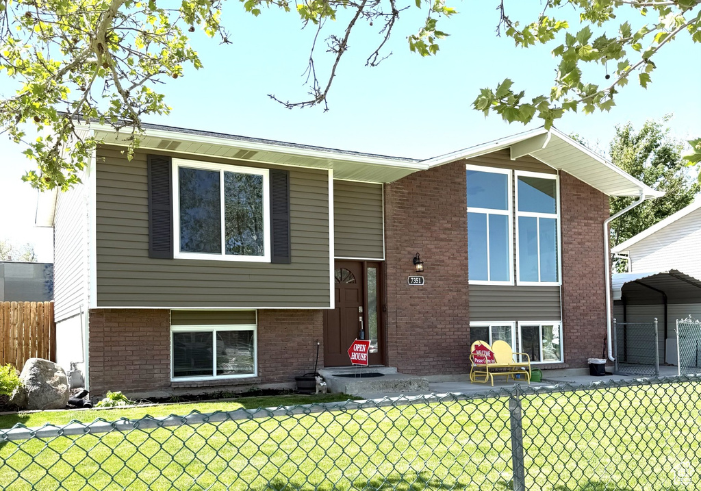View of front of home featuring brick siding