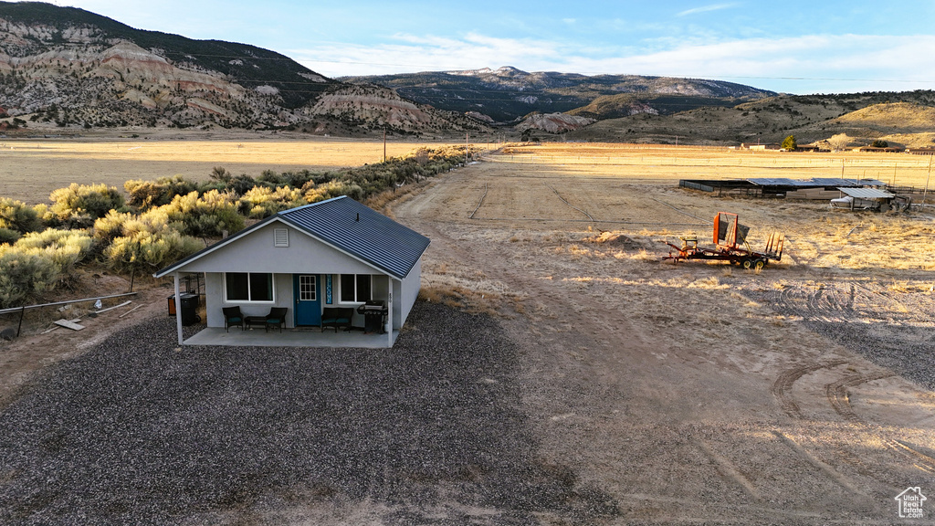 Drone / aerial view with a mountain view and a rural view