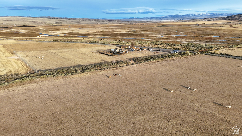 Birds eye view of property featuring a mountain view, a rural view, and a desert view