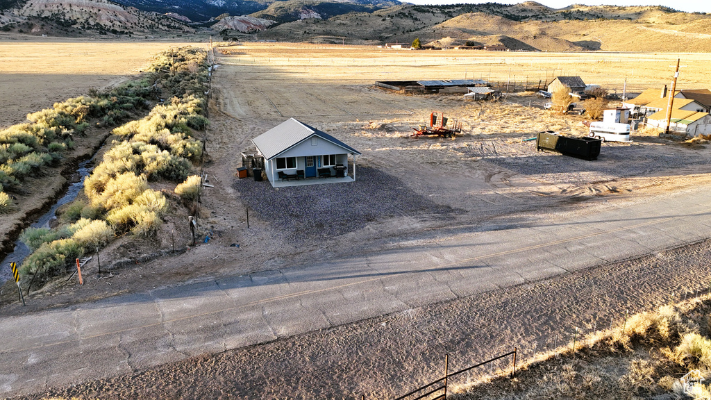 Birds eye view of property featuring a rural view and a mountain view