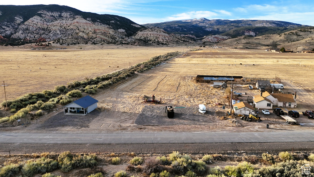 Birds eye view of property featuring a mountain view and a rural view