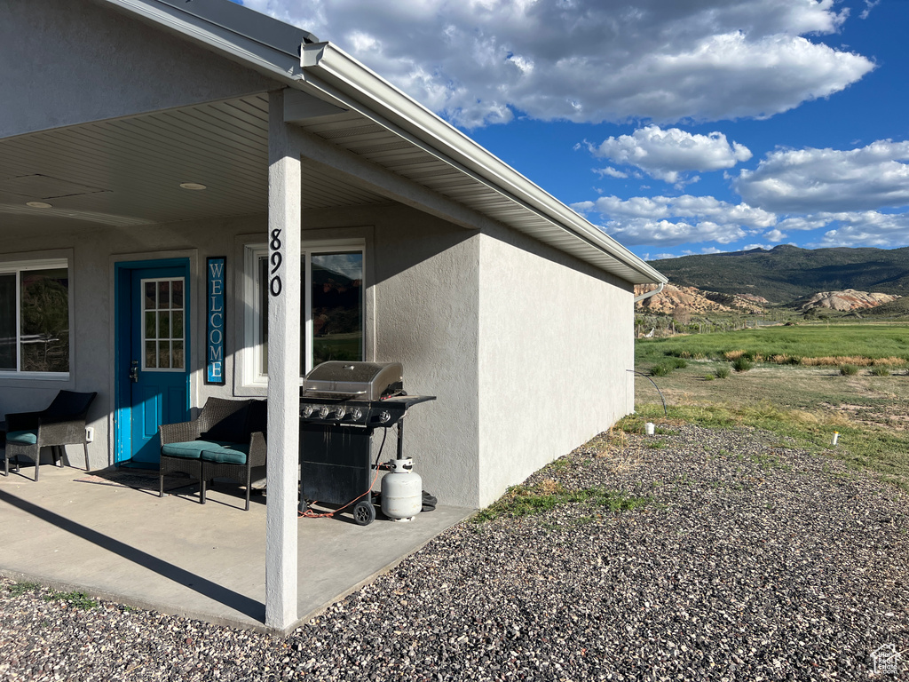 Exterior space with a mountain view and stucco siding