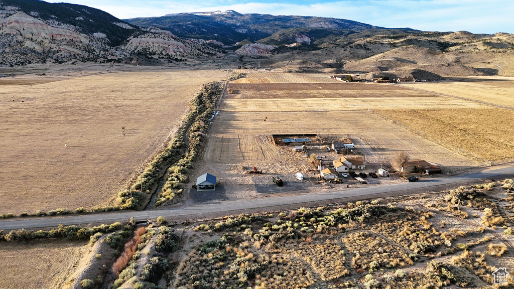 Birds eye view of property with a rural view and a mountain view