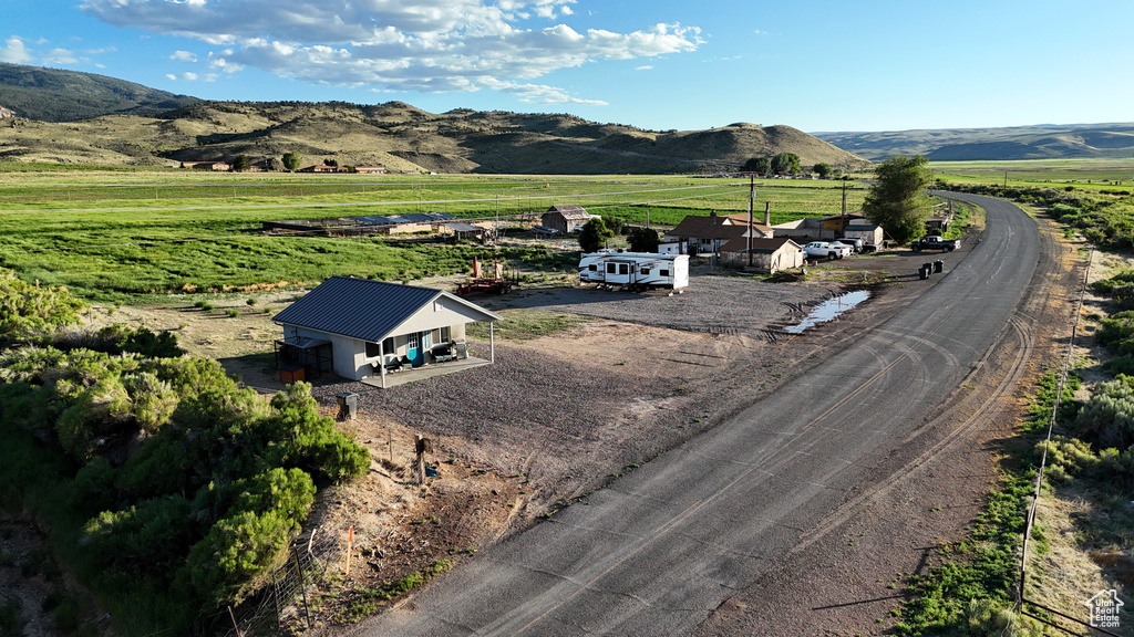 Property view of mountains with a rural view