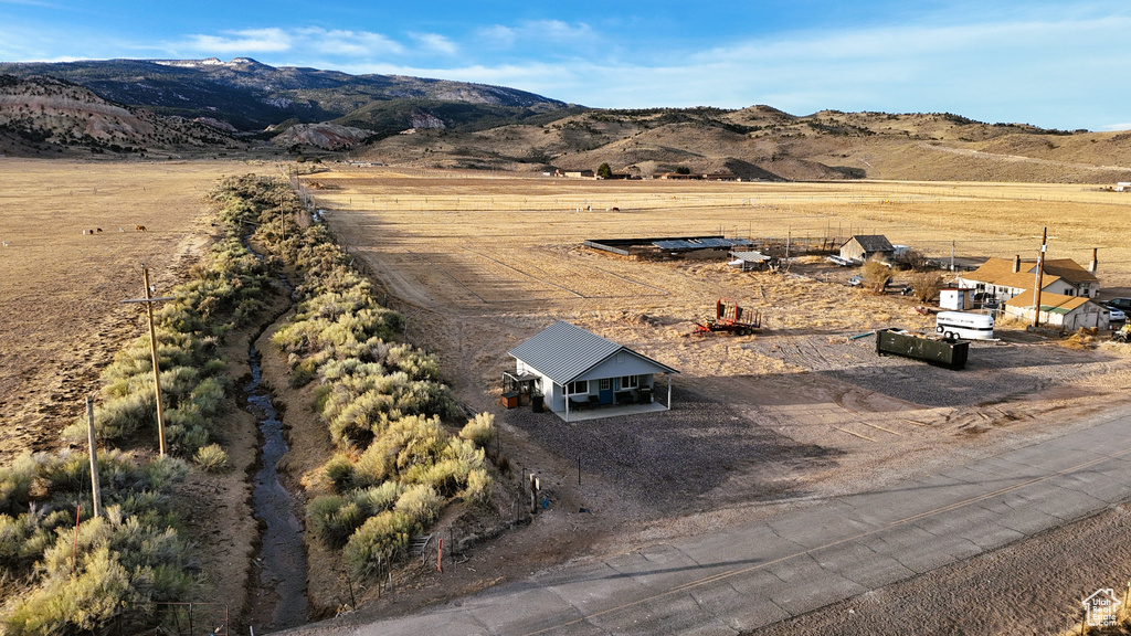 Birds eye view of property with a mountain view and a rural view