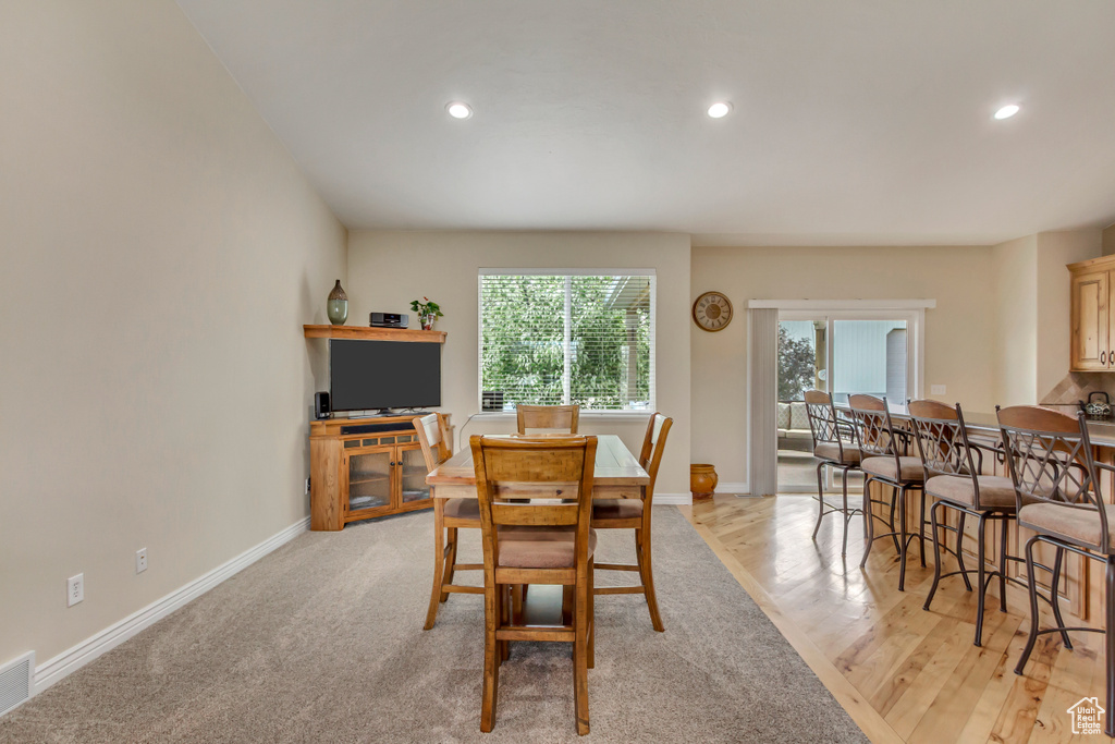 Dining space with visible vents, recessed lighting, light wood finished floors, and baseboards
