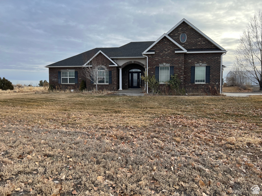 View of front of home featuring brick siding