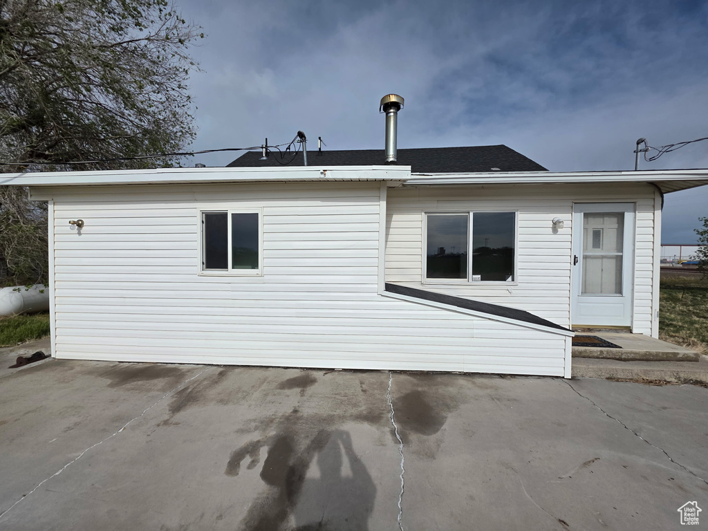 Back of house with a patio