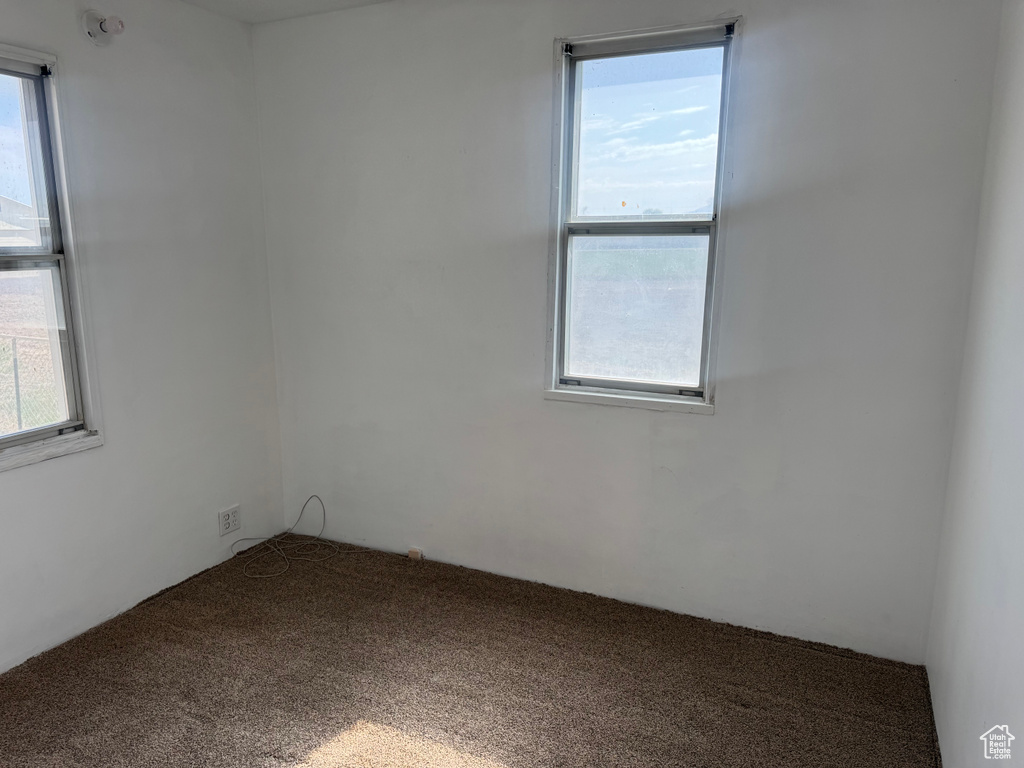 Empty room featuring carpet floors