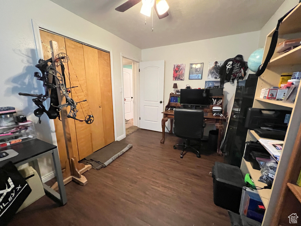 Office area with wood finished floors and a ceiling fan