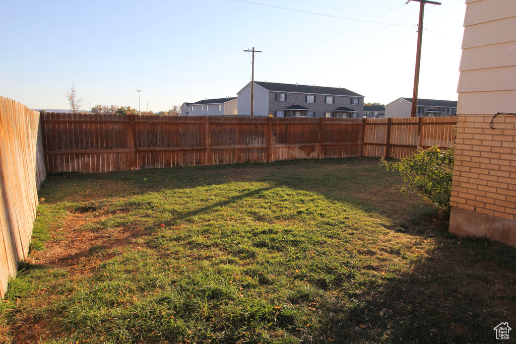 View of yard with a fenced backyard