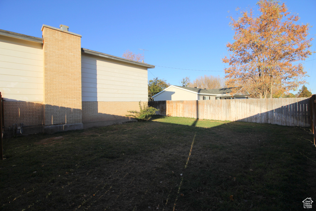 View of yard with fence