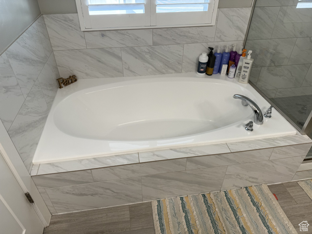 Full bathroom featuring a garden tub