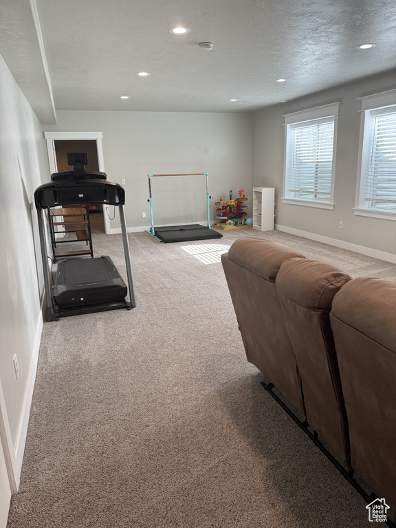 Exercise area with recessed lighting, carpet, and baseboards