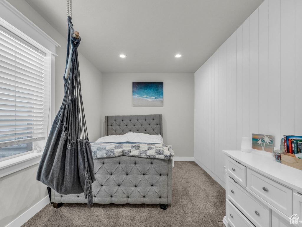 Bedroom featuring light carpet, recessed lighting, and baseboards