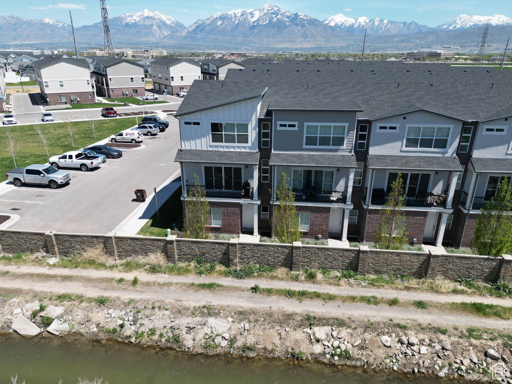 Birds eye view of property with a residential view and a mountain view
