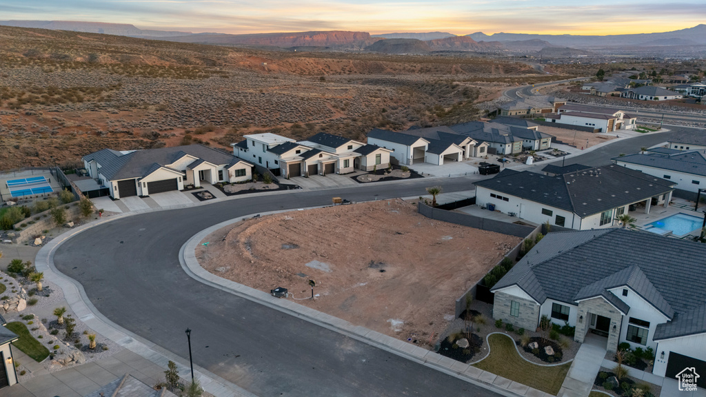 Birds eye view of property featuring a mountain view and a residential view