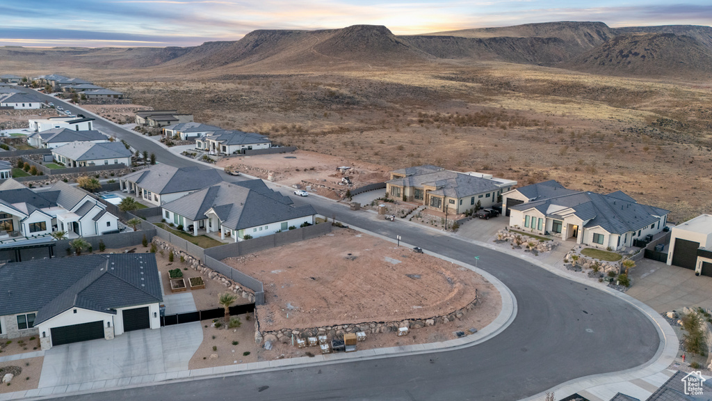 Birds eye view of property with a residential view and a mountain view