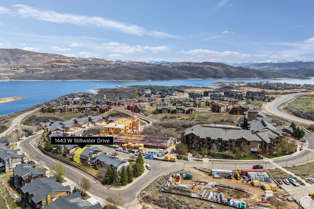 Drone / aerial view with a water and mountain view