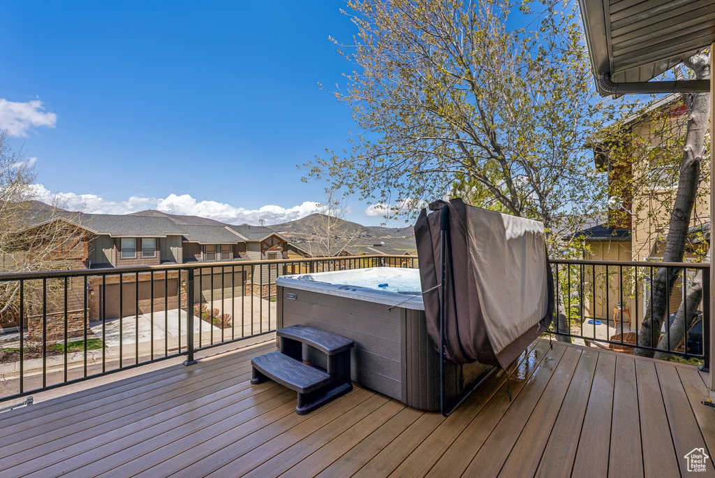 Wooden terrace with a hot tub