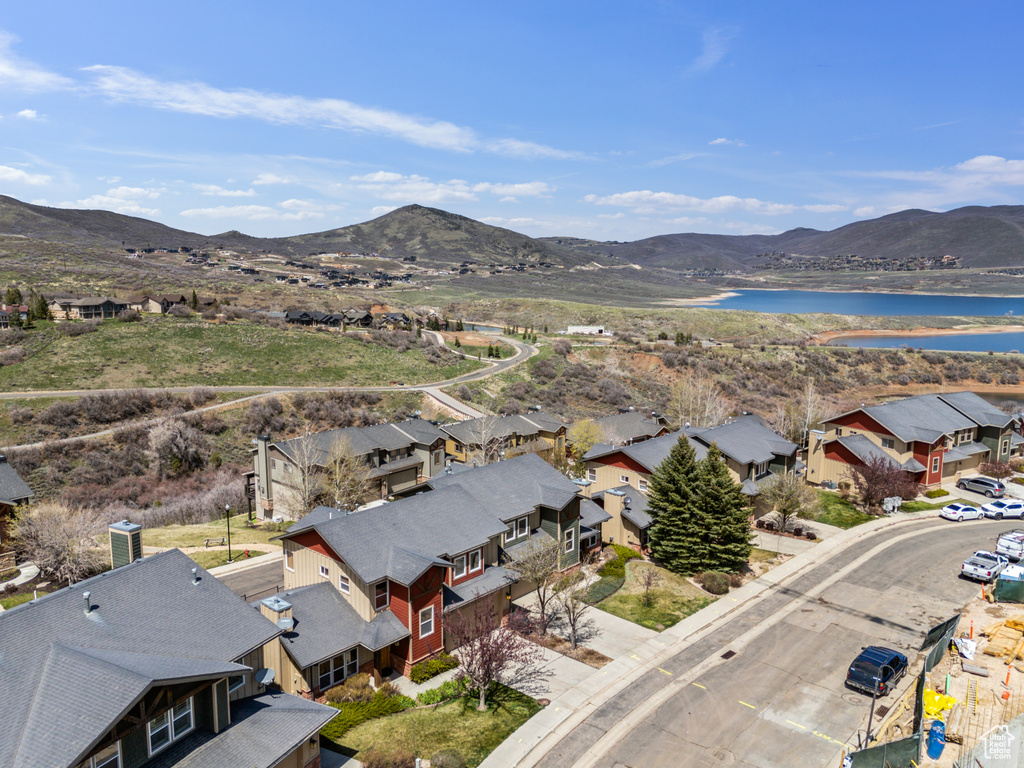 Birds eye view of property with a residential view and a water and mountain view