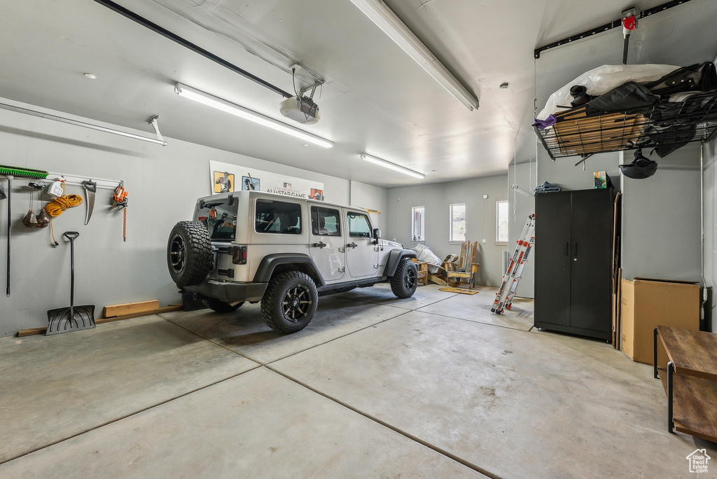 Garage featuring a garage door opener