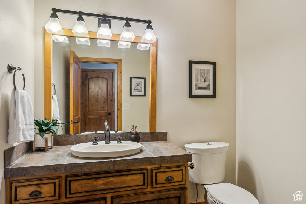 Bathroom featuring toilet and vanity