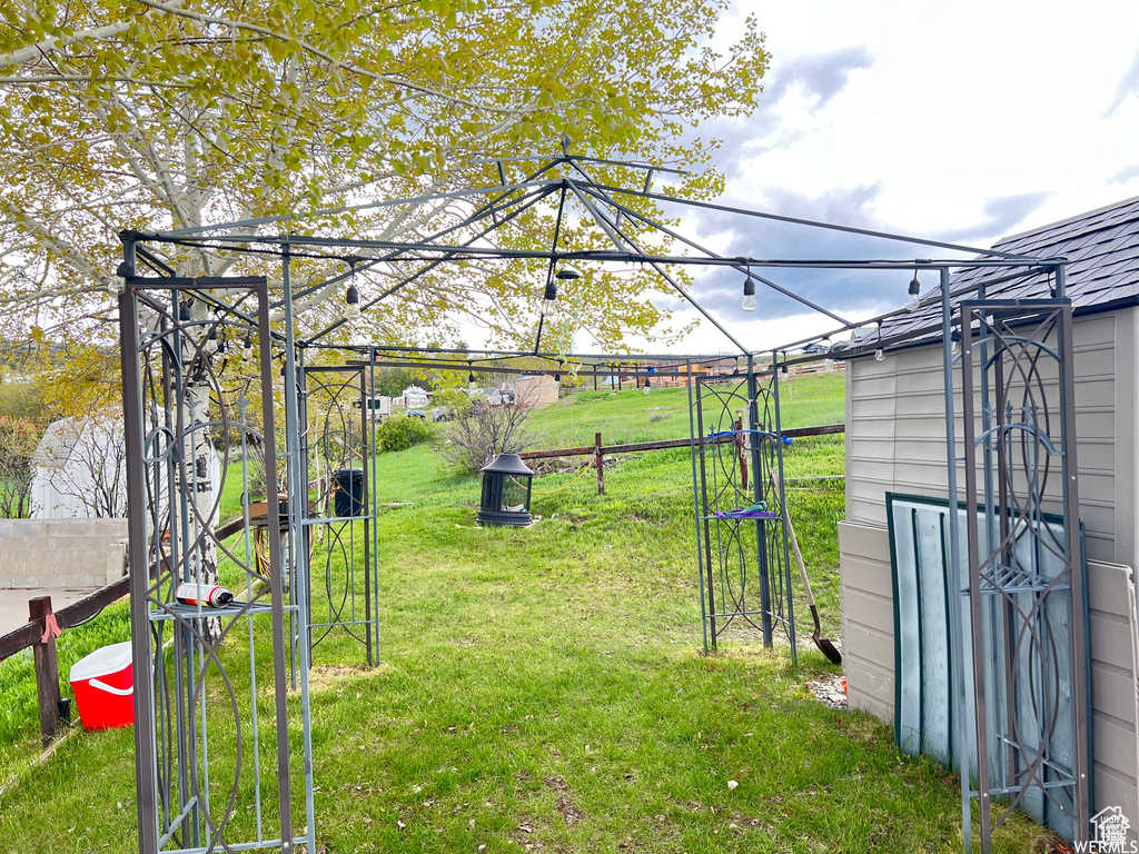 View of yard featuring fence