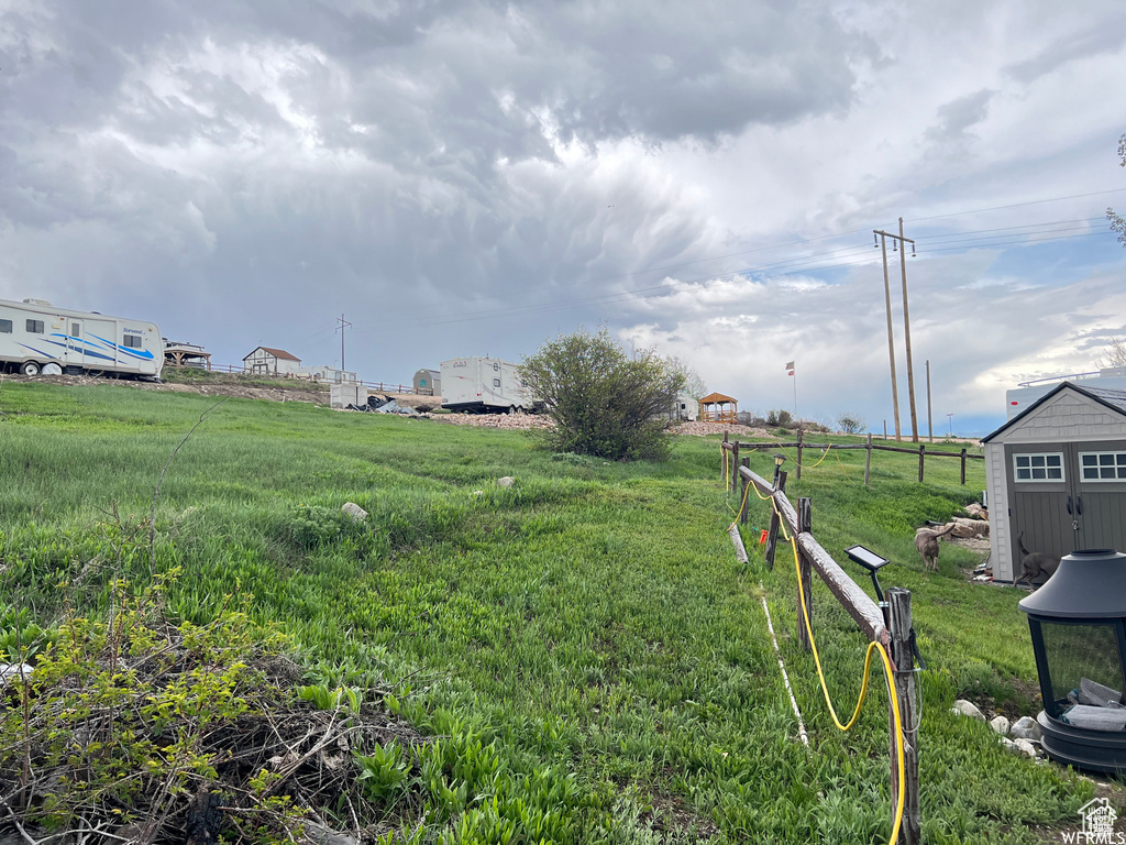 View of yard featuring fence