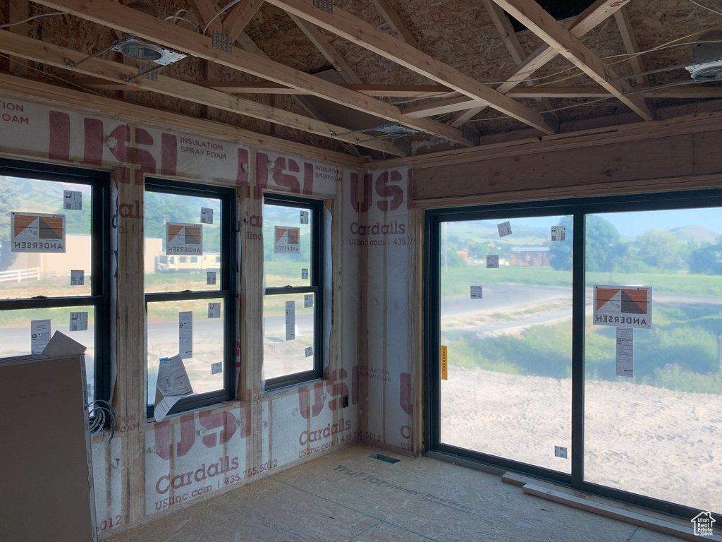Unfurnished sunroom with plenty of natural light