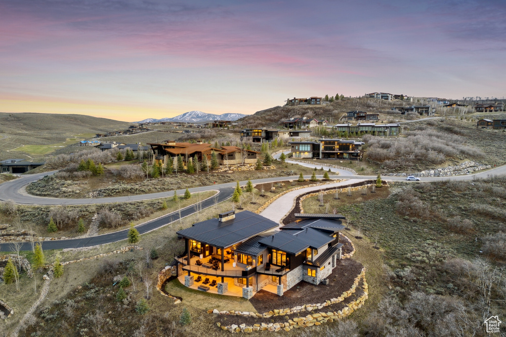 Aerial view at dusk featuring a mountain view