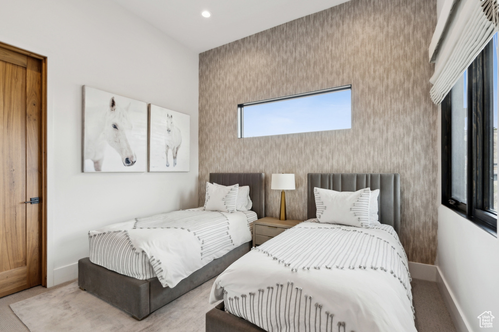 Bedroom featuring baseboards, wallpapered walls, carpet flooring, and recessed lighting
