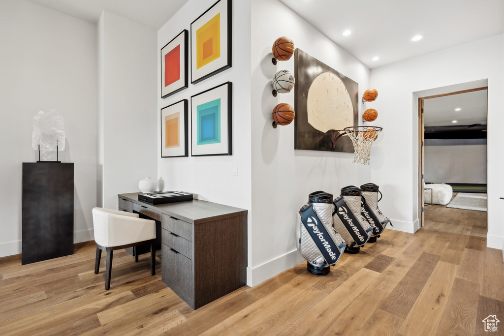 Hallway featuring recessed lighting, light wood-style flooring, and baseboards